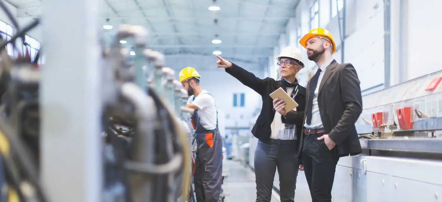 Portraits of workers in factory.